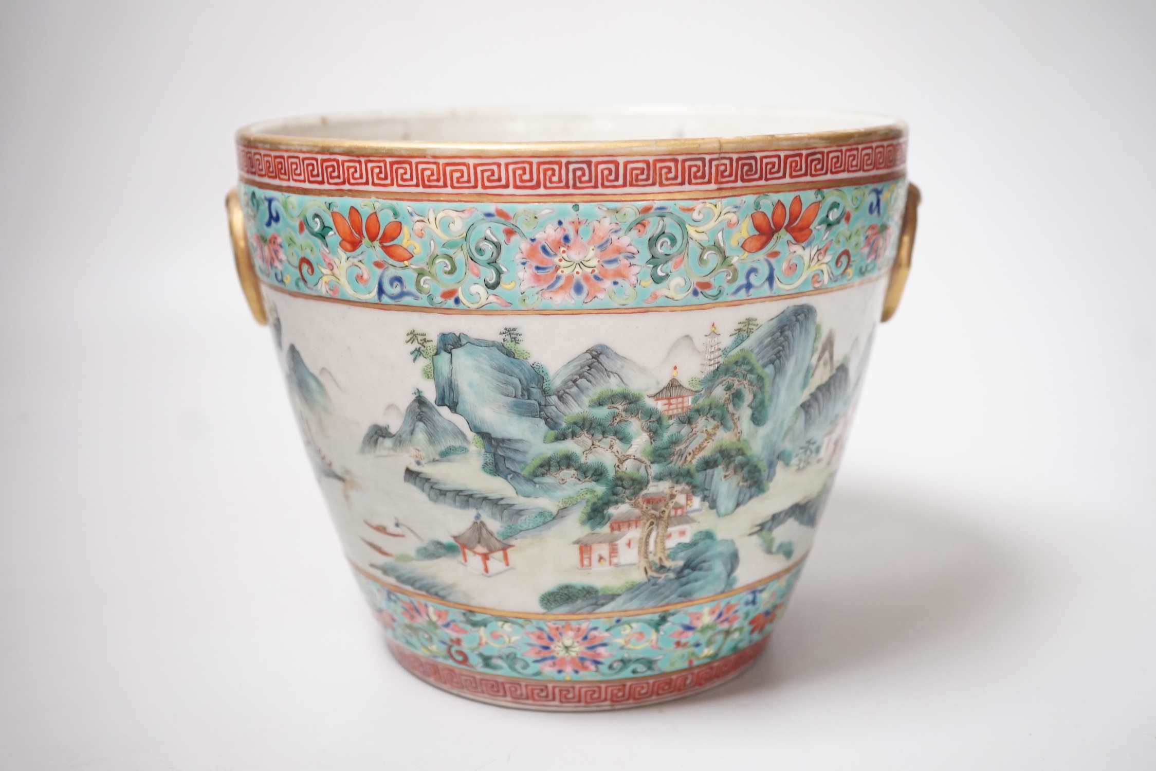 A 19th century Chinese famille rose ‘landscape’ planter, 15cm tall, rim crack